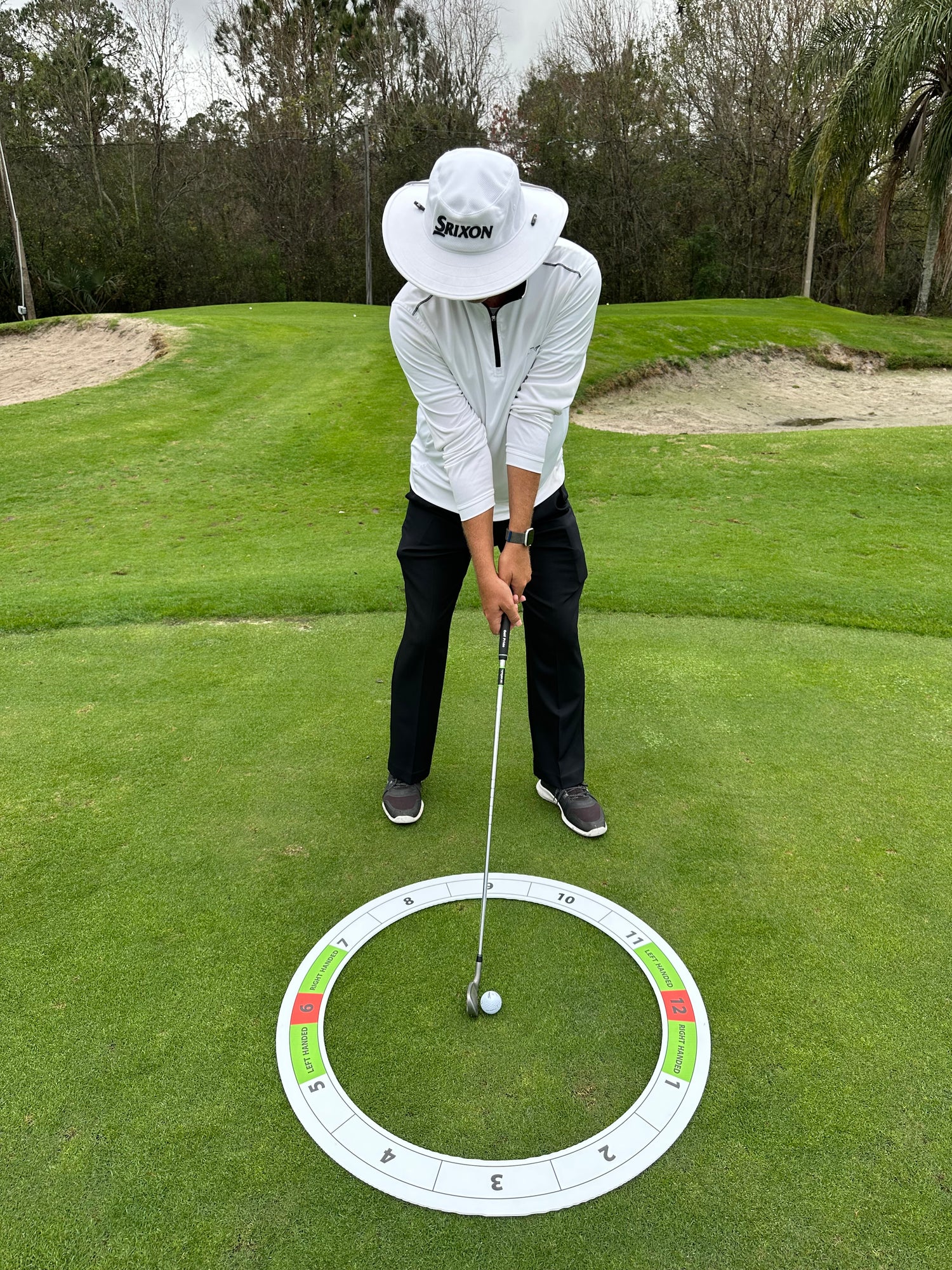 Golf Clock Visual Training System in use at driving range